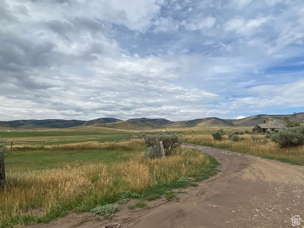 Property view of mountains with a rural view