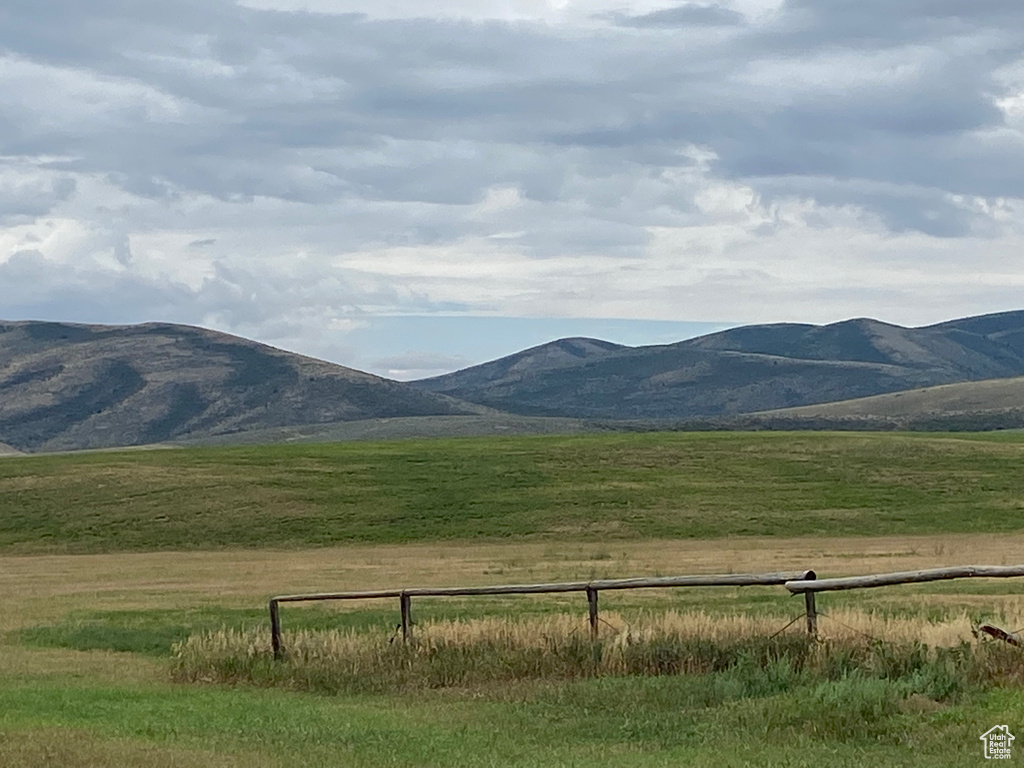 Property view of mountains with a rural view