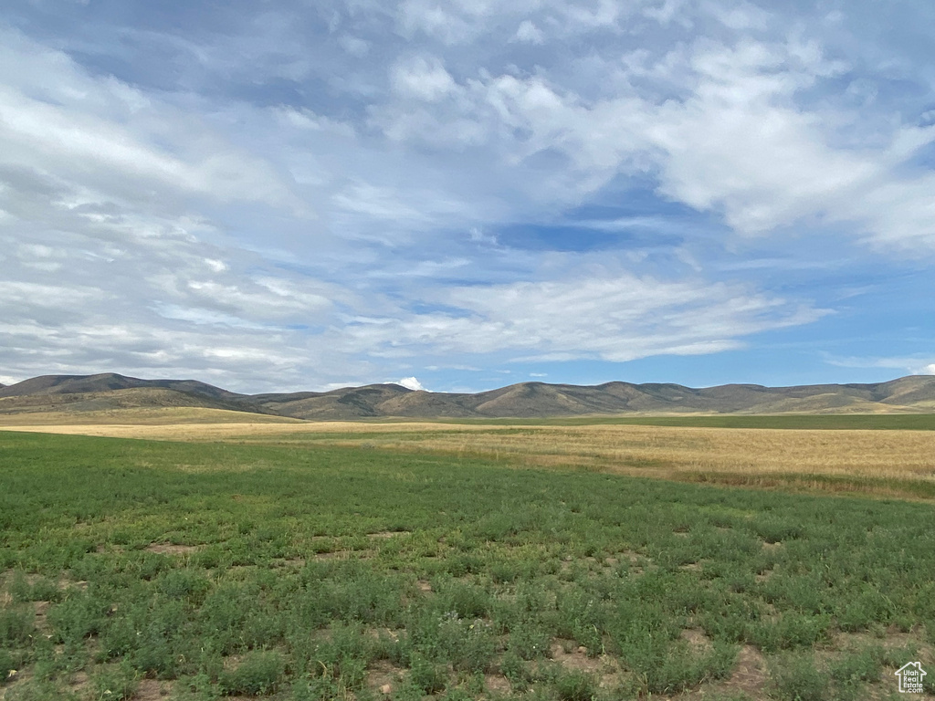 Property view of mountains featuring a rural view