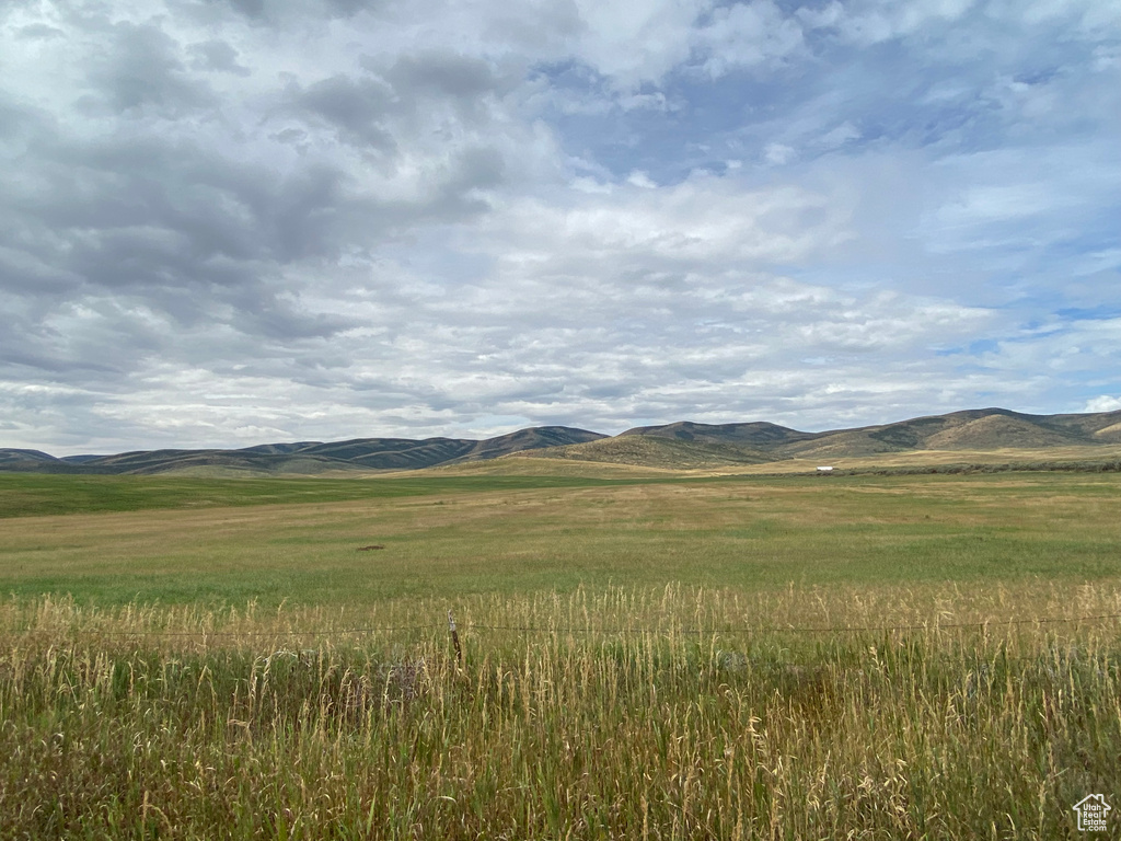 Property view of mountains with a rural view