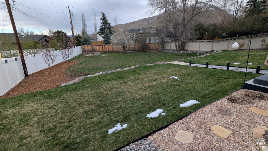 View of yard with a fenced backyard