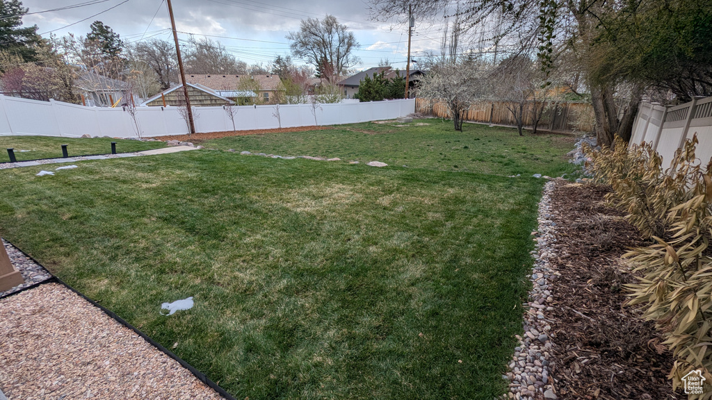 View of yard with a fenced backyard