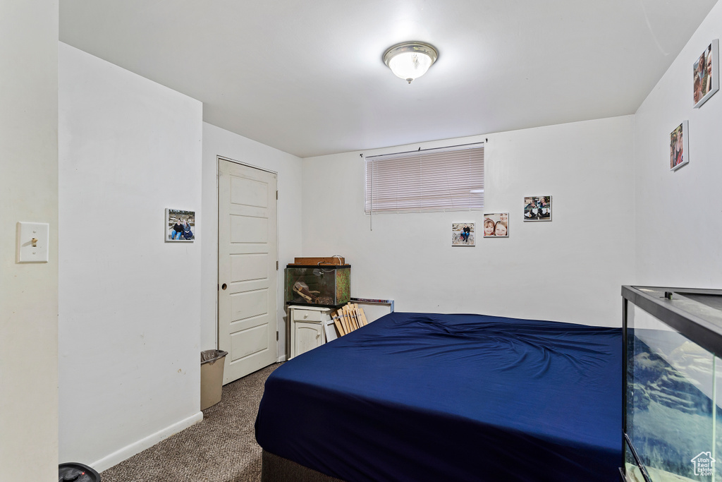 Carpeted bedroom with baseboards
