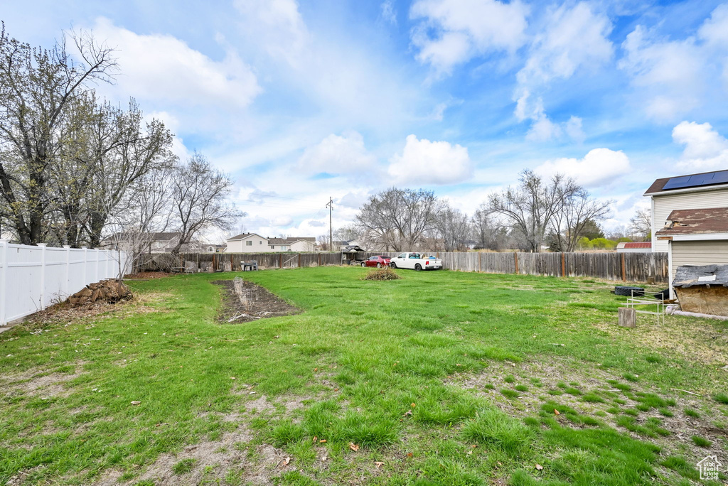 View of yard featuring a fenced backyard