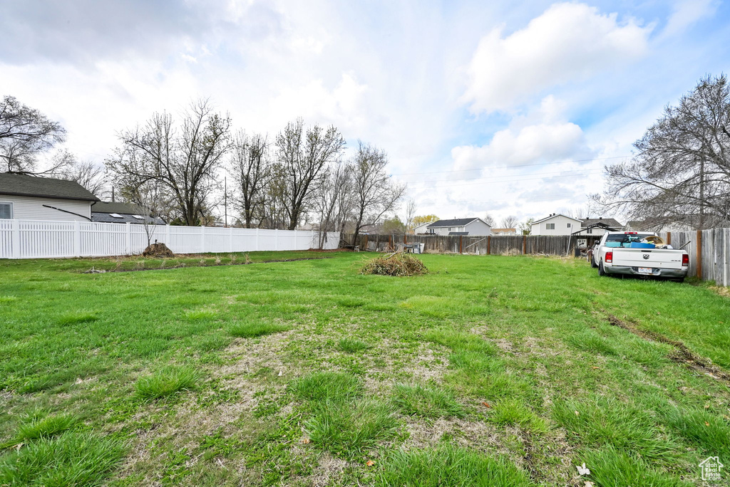 View of yard featuring a fenced backyard