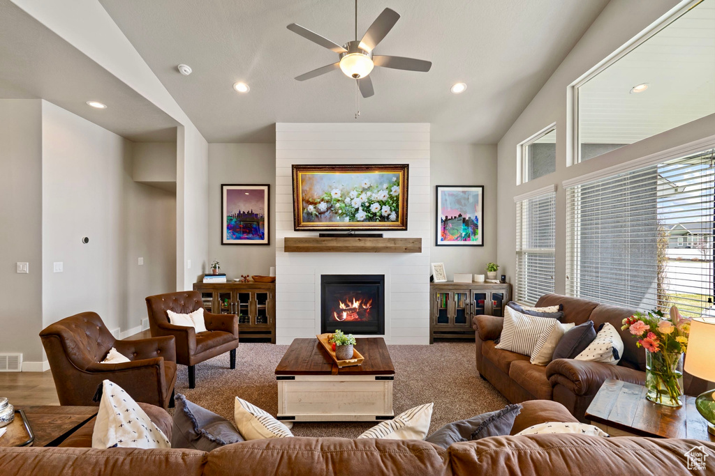 Living area with visible vents, vaulted ceiling, recessed lighting, and a ceiling fan