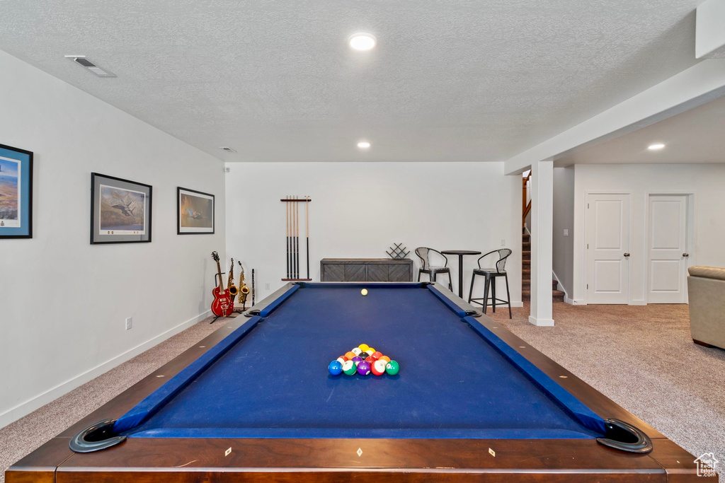Game room with carpet flooring, a textured ceiling, pool table, and visible vents
