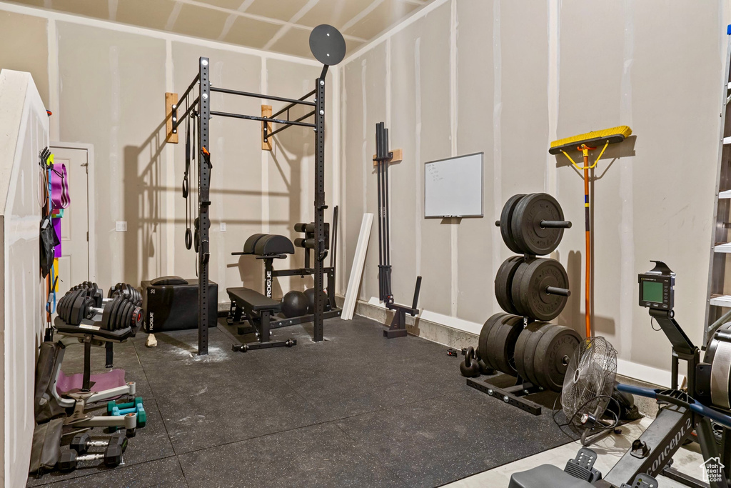 Workout area featuring baseboards