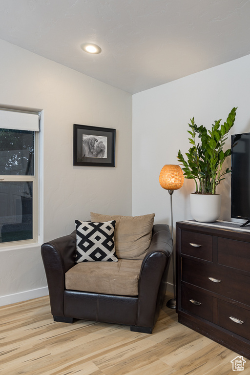 Sitting room featuring light wood finished floors and baseboards