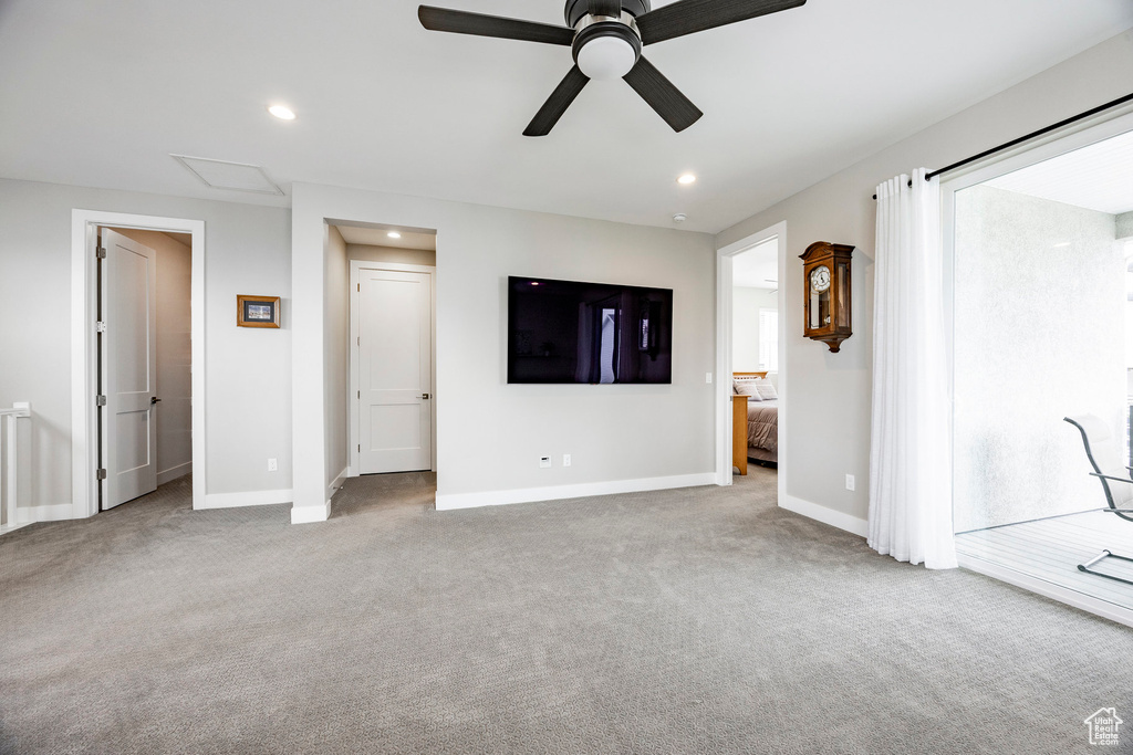 Unfurnished living room featuring recessed lighting, carpet, ceiling fan, and baseboards