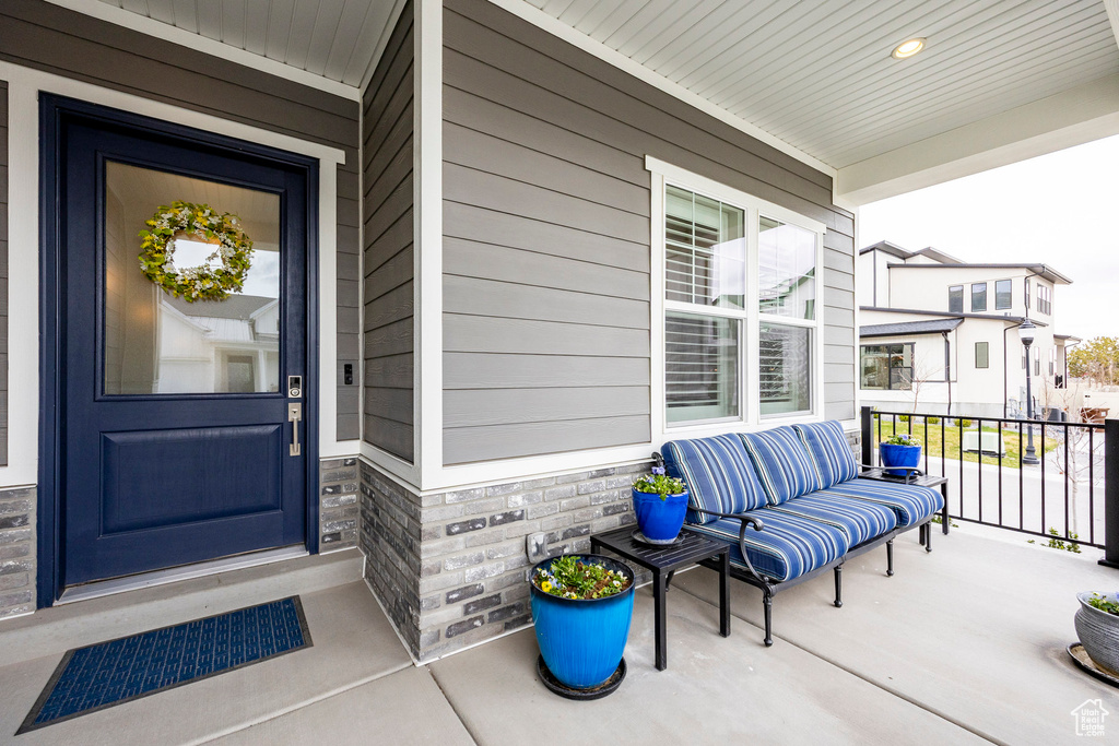 View of exterior entry featuring stone siding