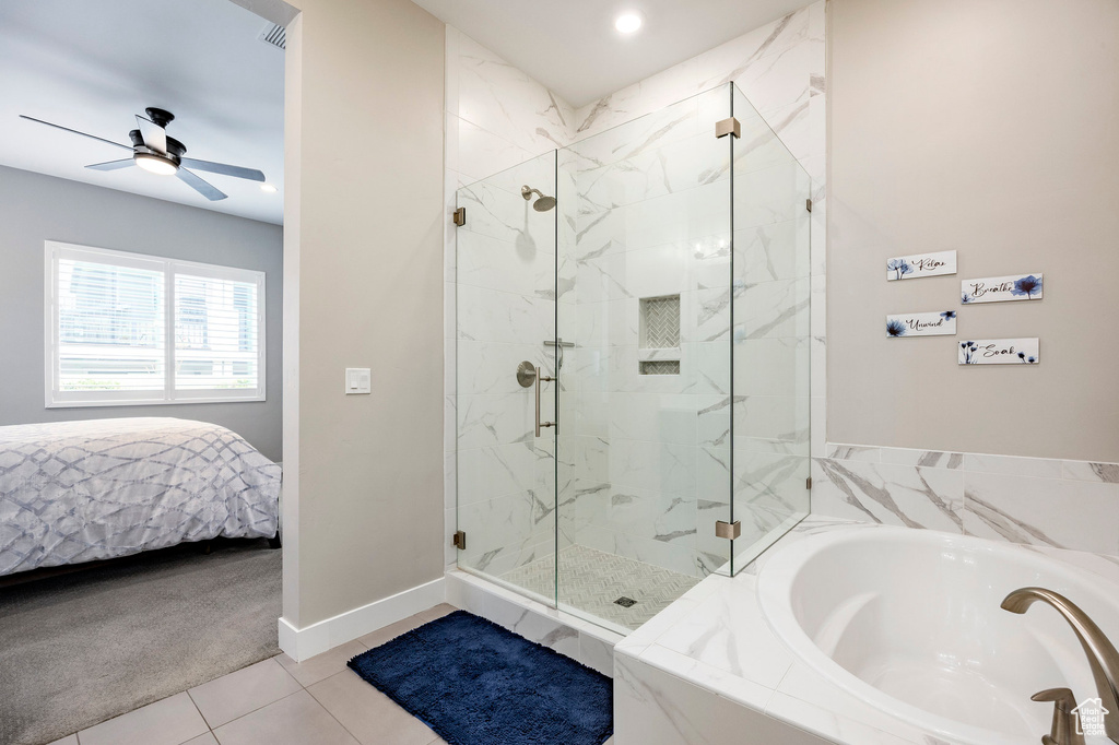Ensuite bathroom with ceiling fan, a bath, tile patterned flooring, a shower stall, and ensuite bath