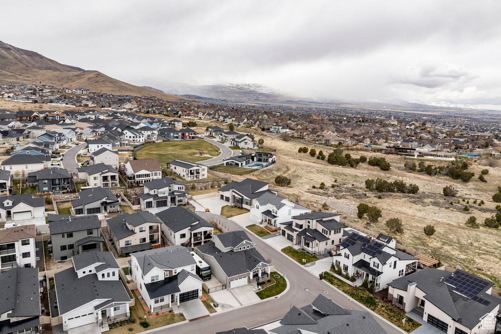 Birds eye view of property with a mountain view and a residential view