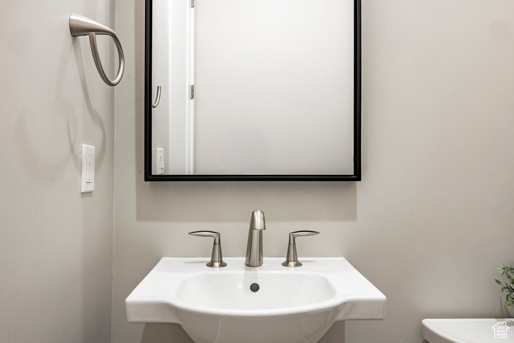 Bathroom featuring a sink and toilet