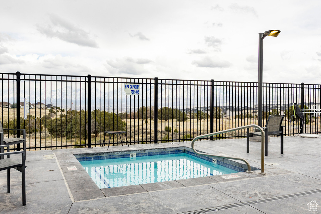View of swimming pool with fence