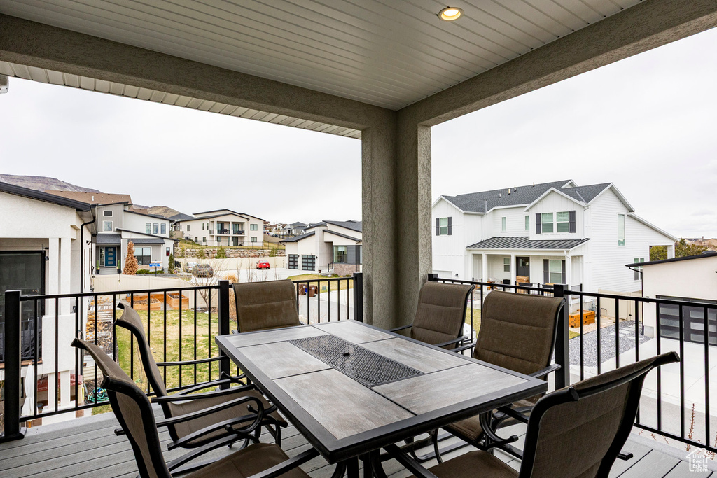 Deck featuring a residential view and outdoor dining area
