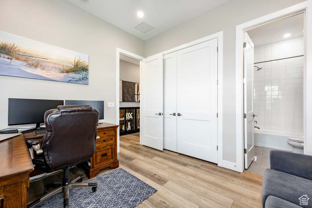 Office space featuring recessed lighting, light wood-style flooring, and visible vents