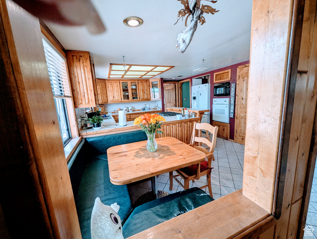 Dining room featuring light tile patterned flooring