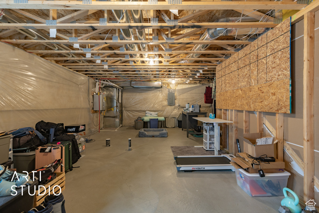 Unfinished below grade area with electric panel