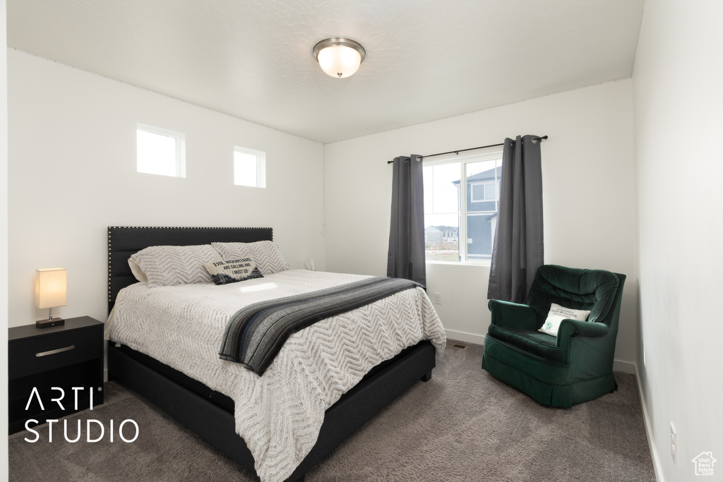 Bedroom featuring baseboards and carpet flooring