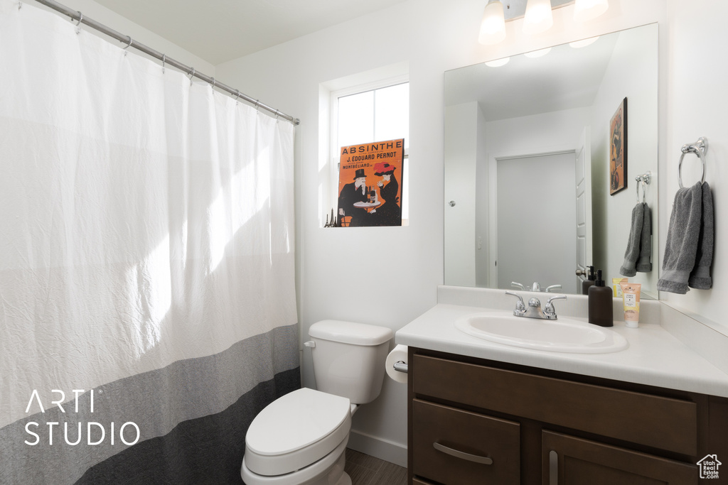 Bathroom with toilet and vanity
