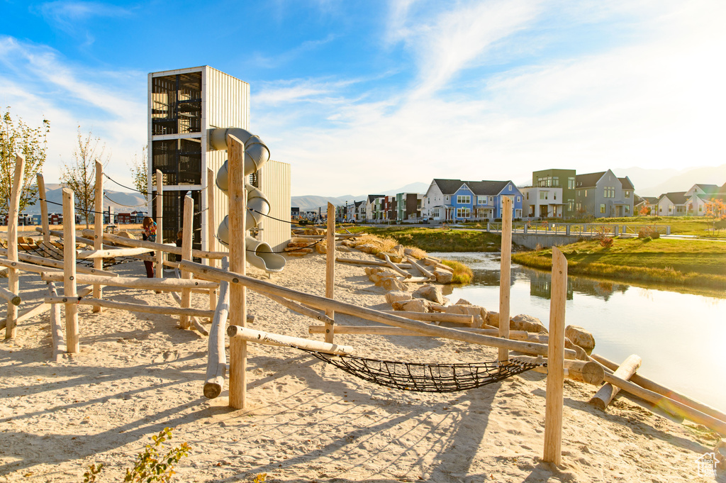 Exterior space featuring a residential view and a water view