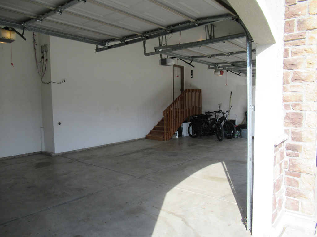 Garage featuring a garage door opener