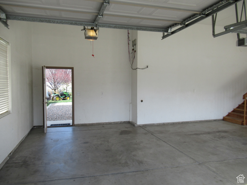 Garage featuring a garage door opener