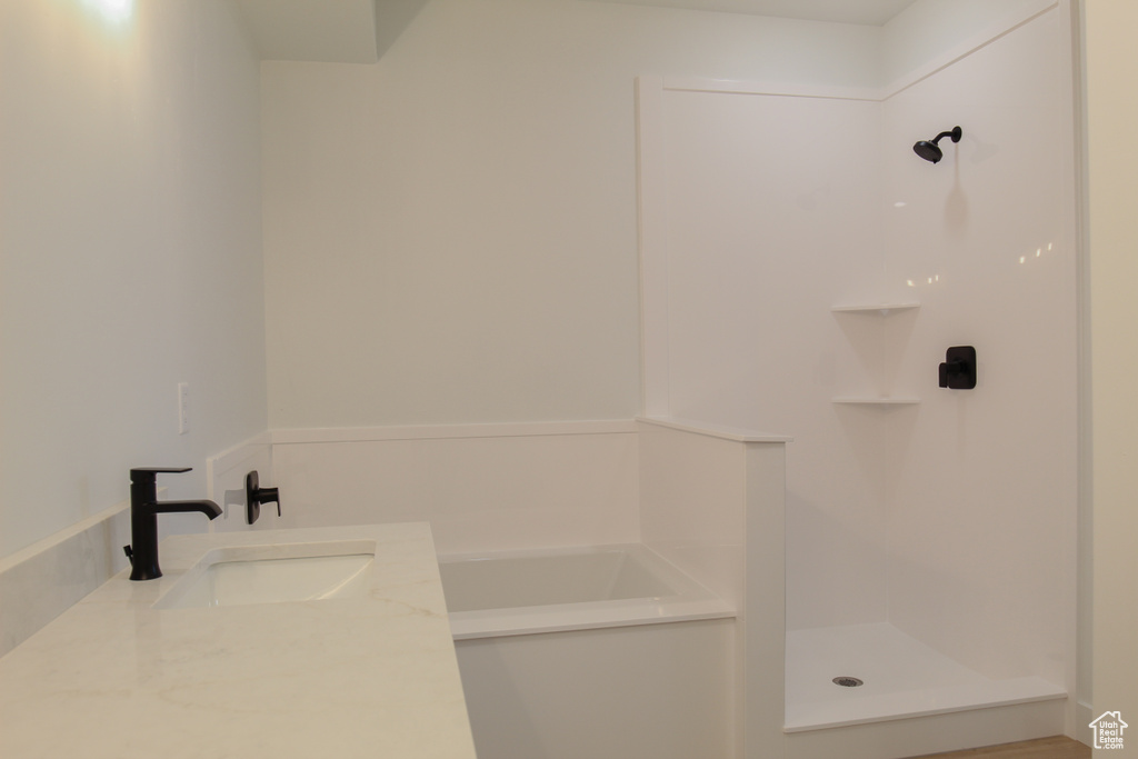 Bathroom featuring a shower and a sink