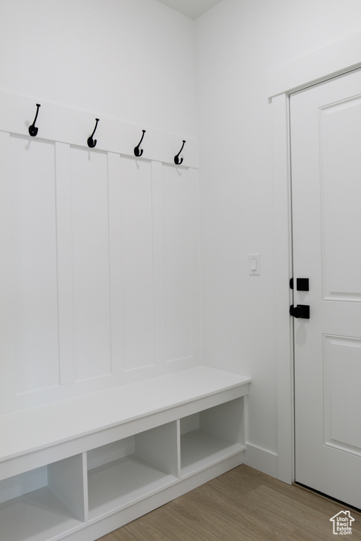 Mudroom with light wood finished floors