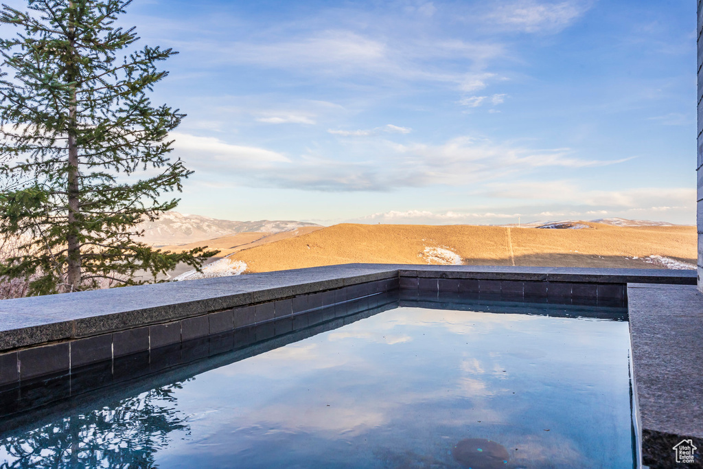 Outdoor pool with a mountain view