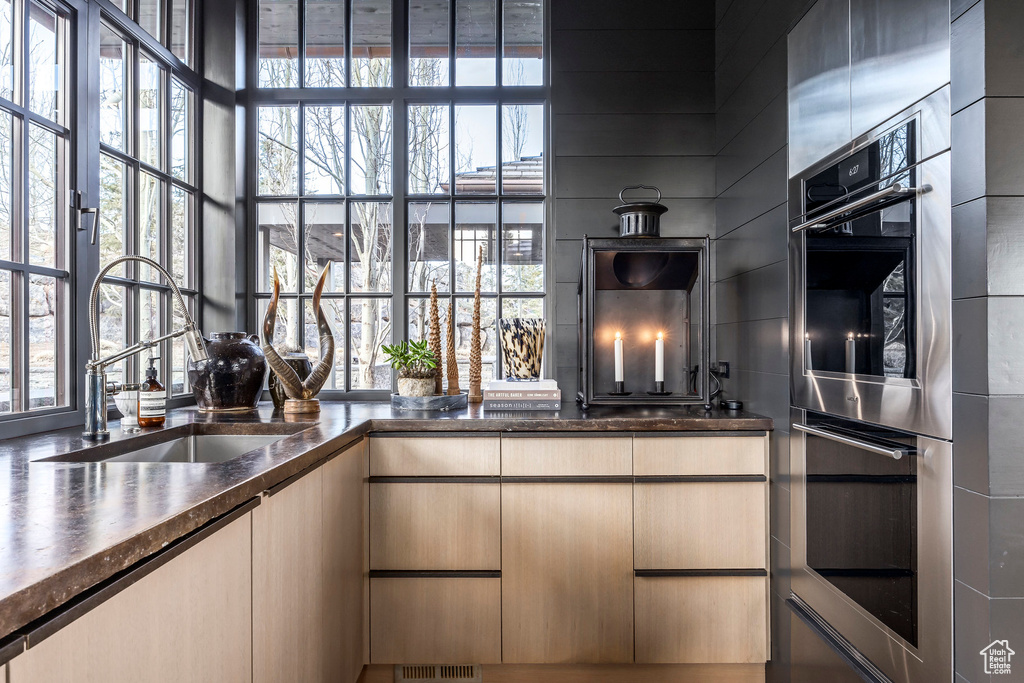 Kitchen with a sink and double oven