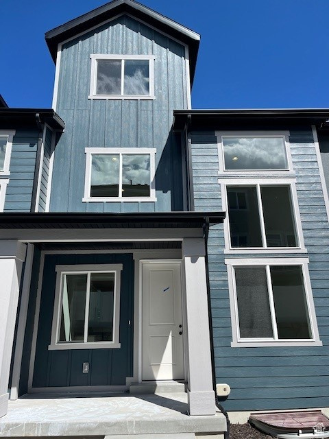 View of front of home with board and batten siding
