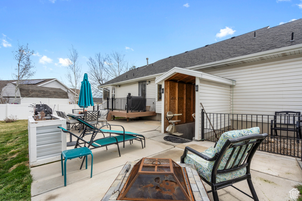 View of patio / terrace with an outdoor fire pit and outdoor dining area