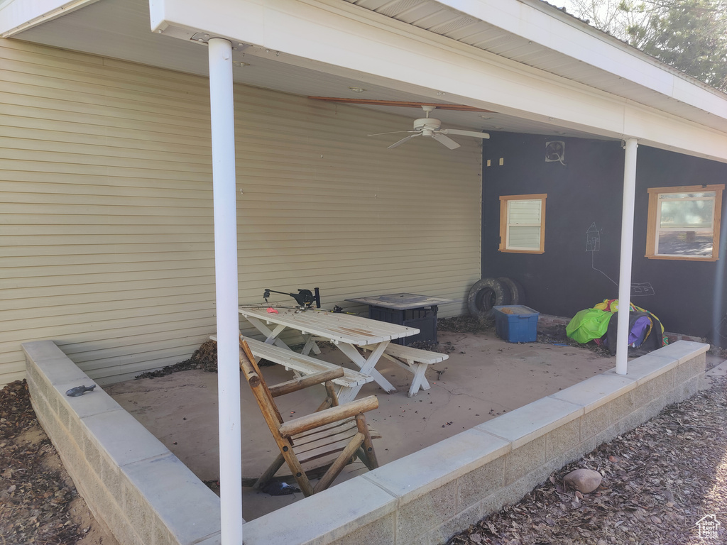 View of patio with a ceiling fan