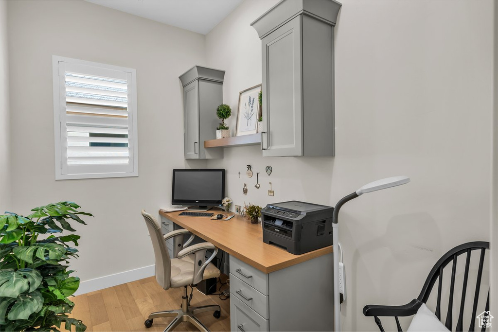 Office featuring baseboards and wood finished floors