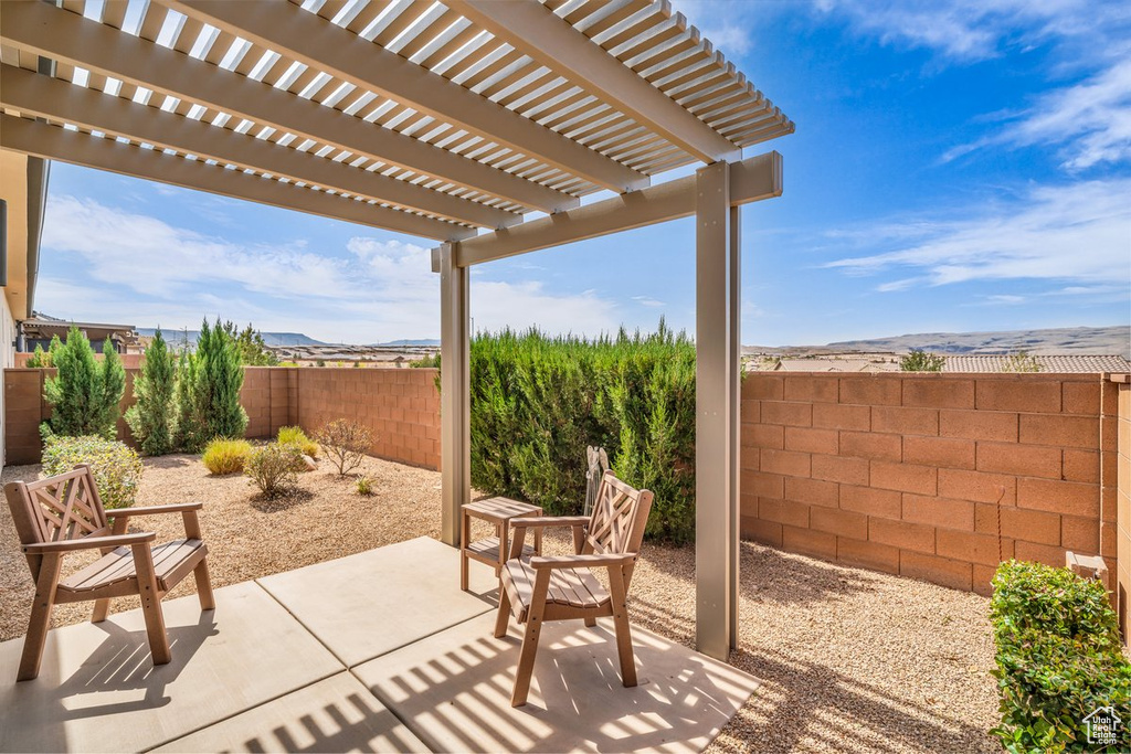 View of patio / terrace featuring a fenced backyard and a pergola