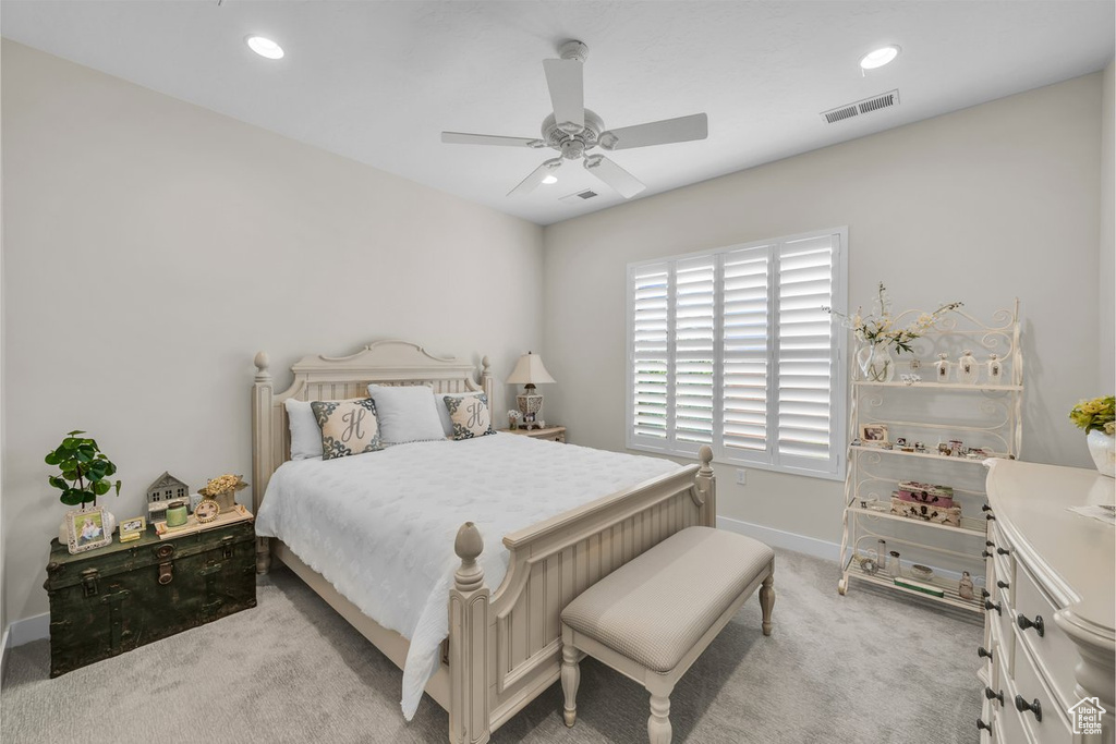 Bedroom with visible vents, baseboards, ceiling fan, recessed lighting, and light colored carpet