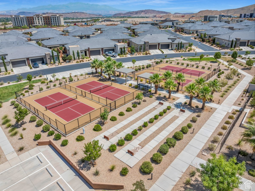 Birds eye view of property with a mountain view and a residential view