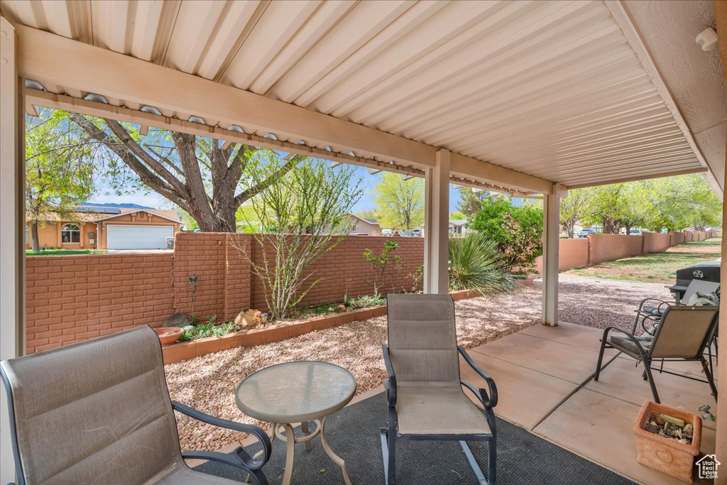 View of patio with a fenced backyard