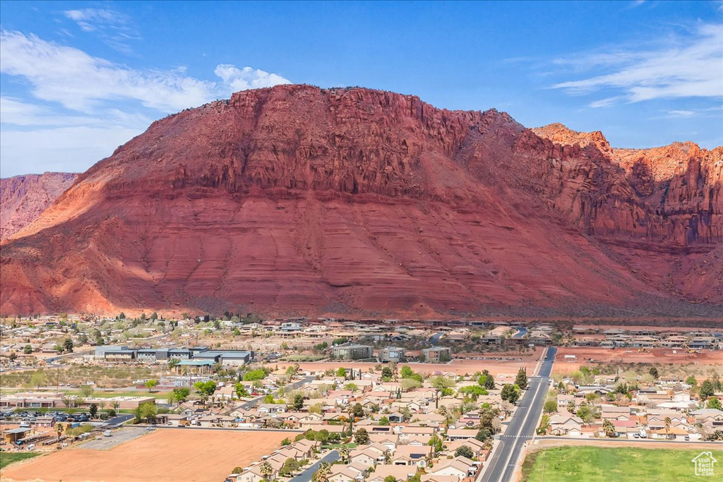 Property view of mountains with a residential view