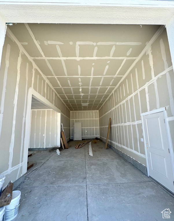 Misc room featuring unfinished concrete flooring