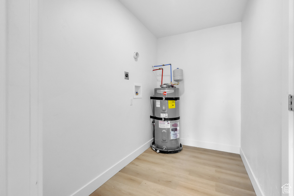 Utility room with strapped water heater
