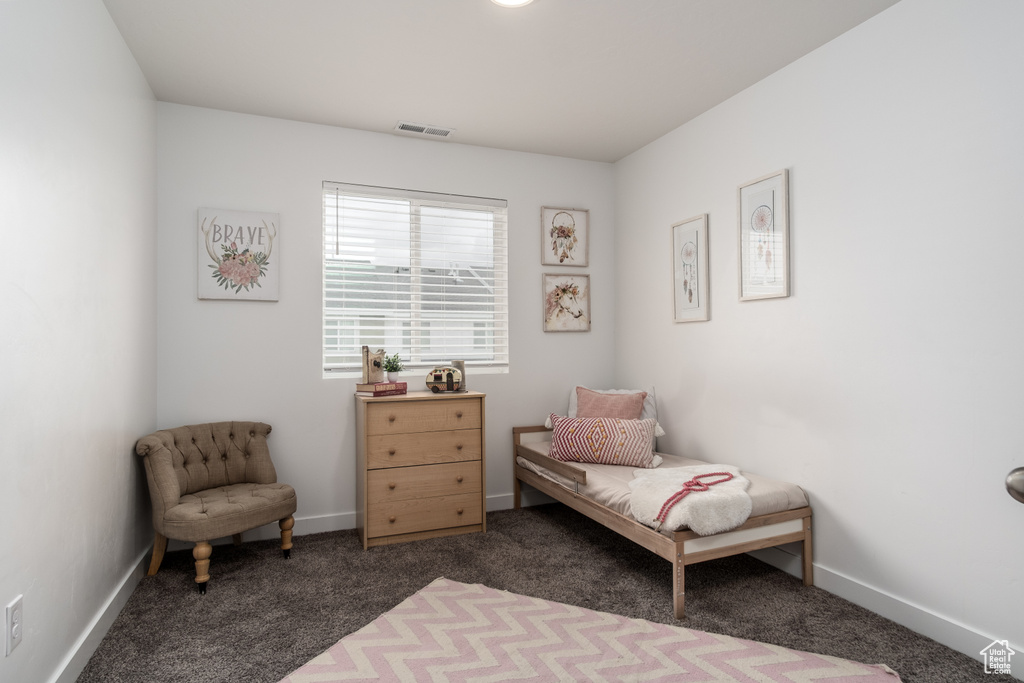 Bedroom featuring baseboards, visible vents, and carpet floors