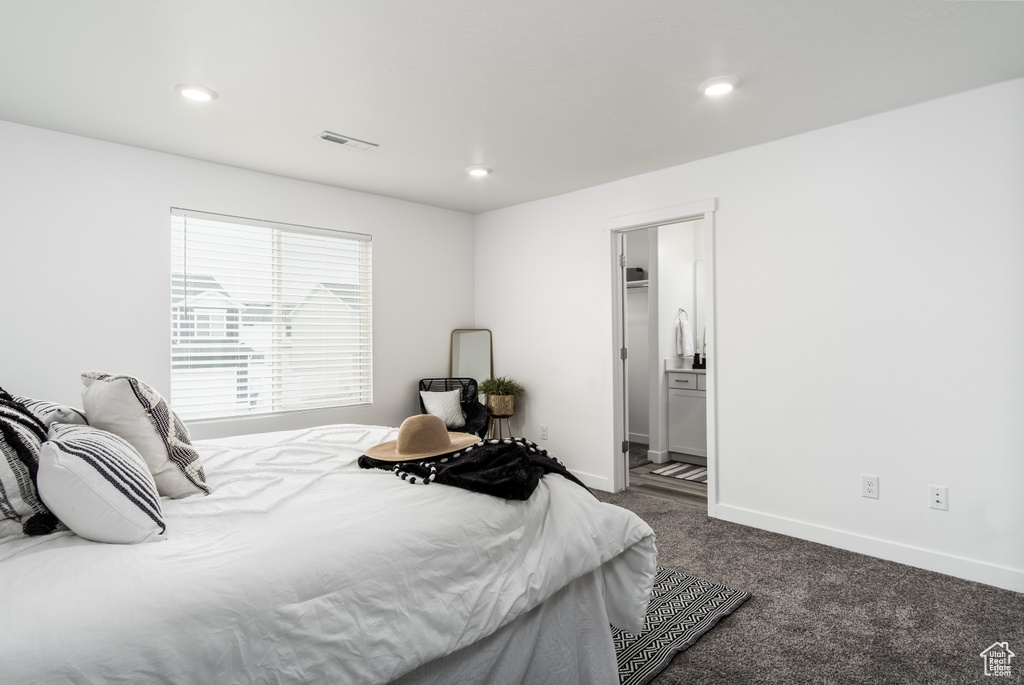 Bedroom featuring baseboards, visible vents, dark carpet, and recessed lighting