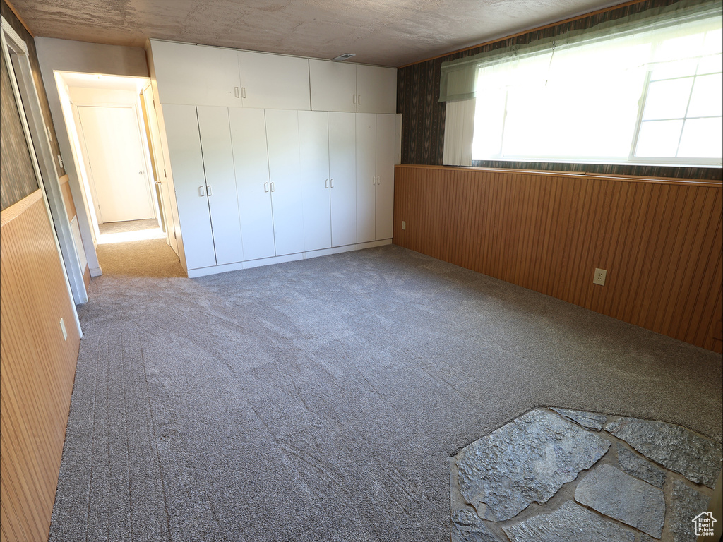 Unfurnished bedroom featuring a closet and carpet