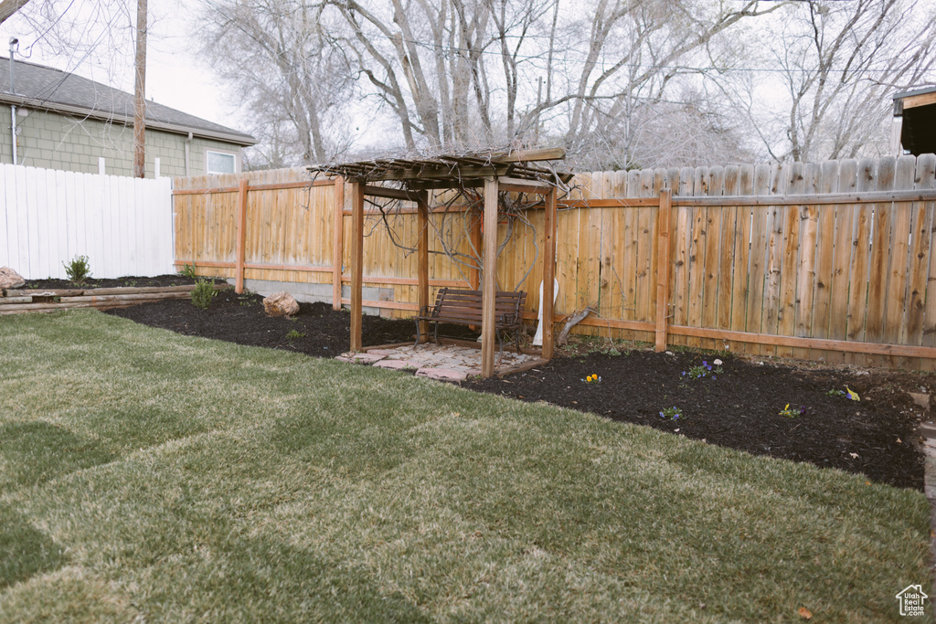 View of yard with a fenced backyard