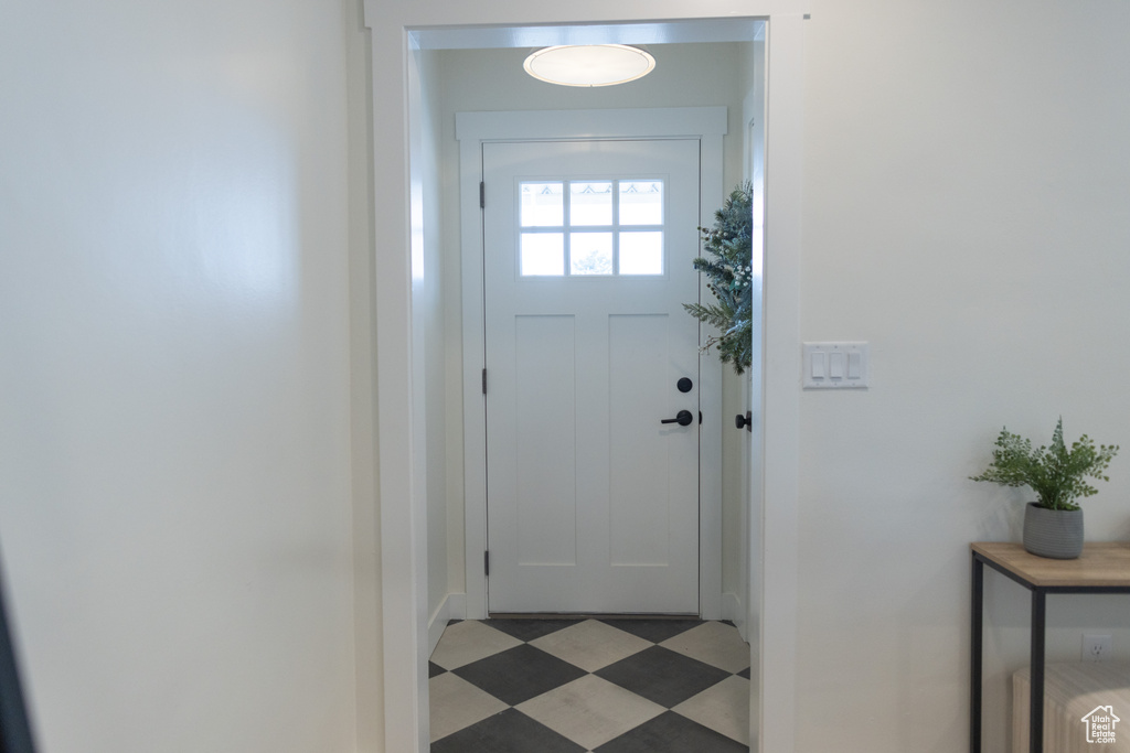 Doorway featuring light floors