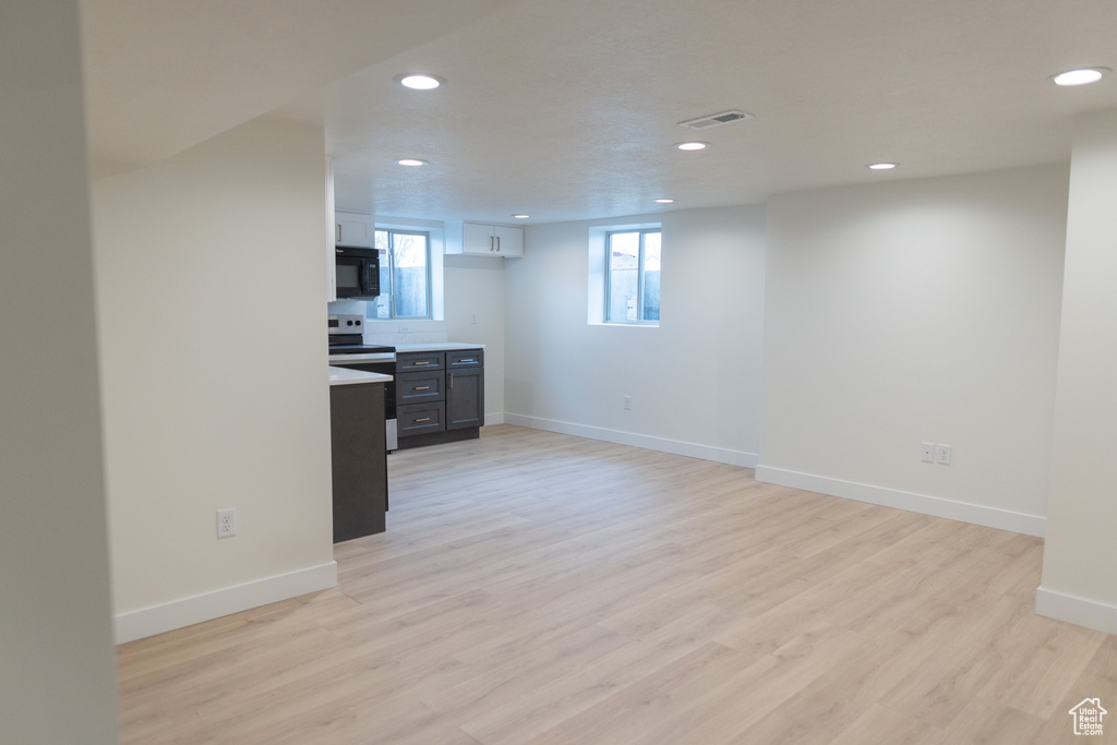 Interior space with recessed lighting, baseboards, and light wood-type flooring
