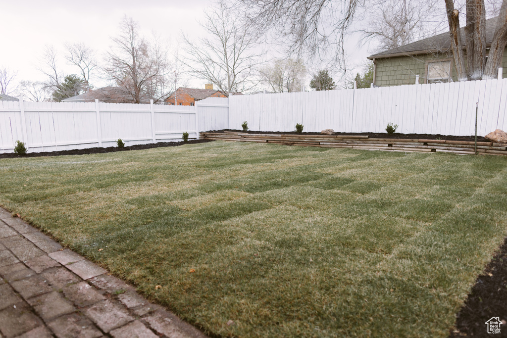 View of yard with a fenced backyard